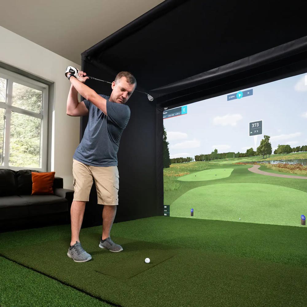 Man using golf simulator